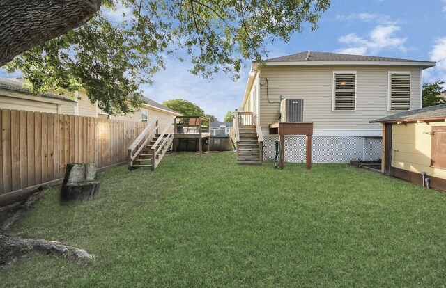5323 Menard Ave, Galveston, TX 77551 - view of yard featuring stairs and a wooden deck