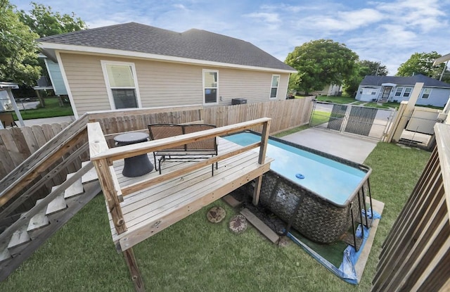 5323 Menard Ave, Galveston, TX 77551 - view of swimming pool with a wooden deck and a gate