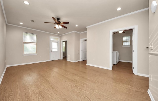 5323 Menard Ave, Galveston, TX 77551 - unfurnished living room featuring a ceiling fan, washer and clothes dryer, light wood-style flooring, plenty of natural light, and recessed lighting