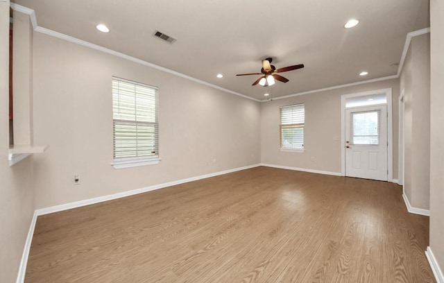 5323 Menard Ave, Galveston, TX 77551 - empty room featuring ceiling fan, wood finished floors, crown molding, recessed lighting, and baseboards