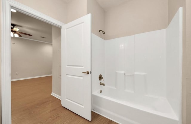 5323 Menard Ave, Galveston, TX 77551 - full bathroom featuring wood finished floors, shower / bath combination, and a ceiling fan