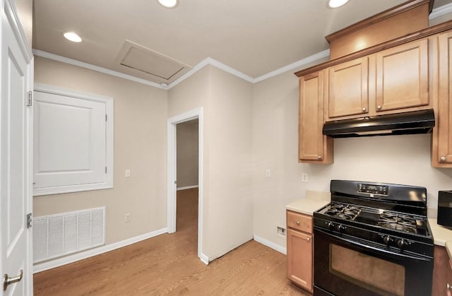 5323 Menard Ave, Galveston, TX 77551 - kitchen featuring black gas stove, under cabinet range hood, crown molding, light wood-type flooring, and light countertops