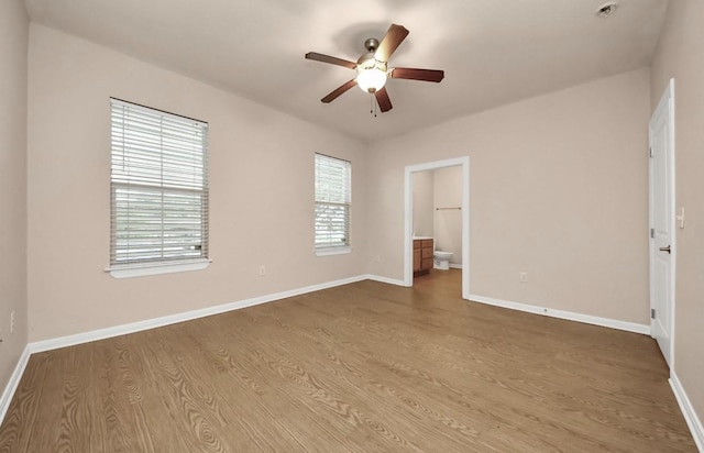 5323 Menard Ave, Galveston, TX 77551 - empty room featuring wood finished floors, a ceiling fan, and baseboards