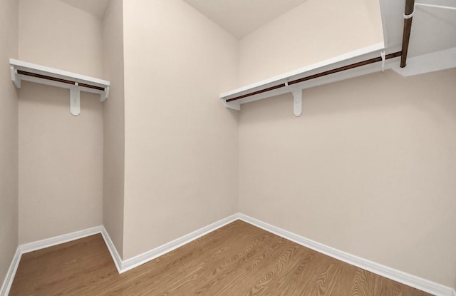 5323 Menard Ave, Galveston, TX 77551 - walk in closet with wood finished floors