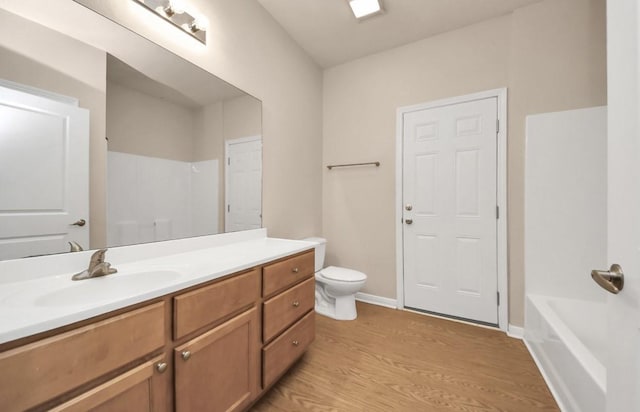 5323 Menard Ave, Galveston, TX 77551 - full bath with wood finished floors, a shower, toilet, vanity, and a bathtub