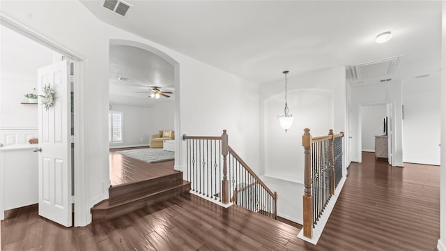 12327 Scherer Woods Ct, Tomball, TX 77377 - hall with an upstairs landing, attic access, wood finished floors, and arched walkways