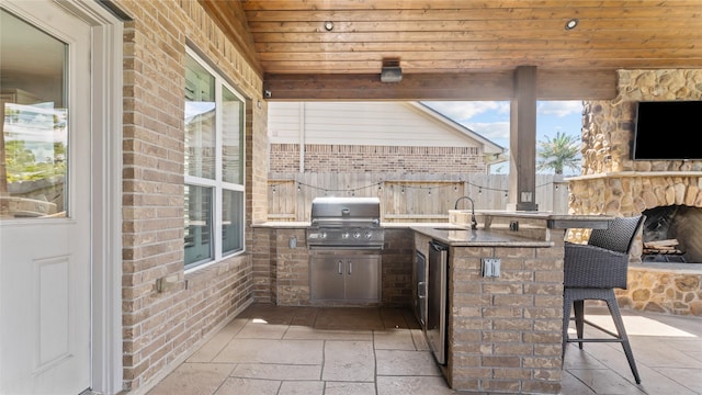 12327 Scherer Woods Ct, Tomball, TX 77377 - view of patio / terrace with a grill, an outdoor kitchen, and fence