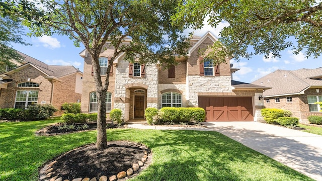 12327 Scherer Woods Ct, Tomball, TX 77377 - view of front of property featuring stone siding, a front lawn, concrete driveway, brick siding, and a garage