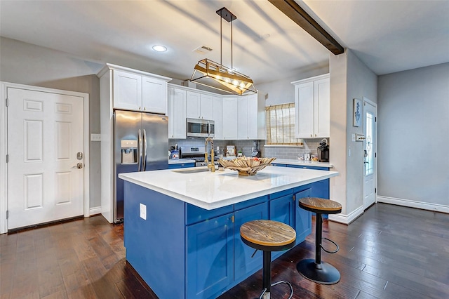 3108 Rogers St, Houston, TX 77022 - kitchen featuring stainless steel appliances, tasteful backsplash, white cabinets, and recessed lighting