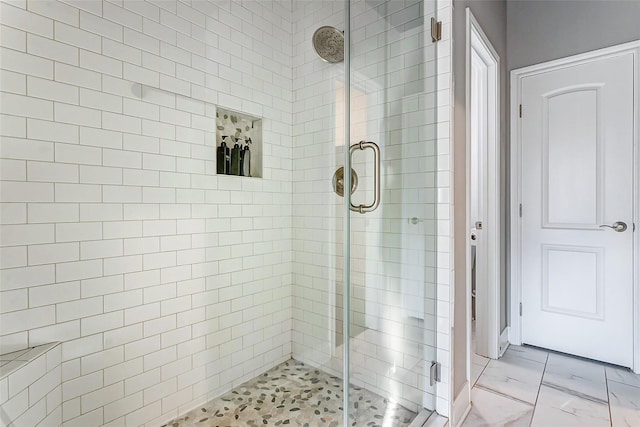 3108 Rogers St, Houston, TX 77022 - bathroom featuring a shower stall and marble finish flooring