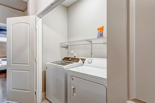 3108 Rogers St, Houston, TX 77022 - washroom featuring independent washer and dryer and wood finished floors