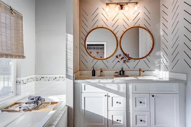 3108 Rogers St, Houston, TX 77022 - bathroom with double vanity, tile walls, and a garden tub