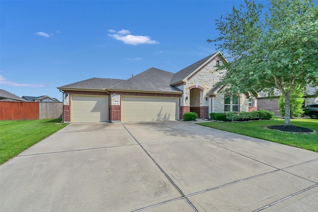 10718 Winding Green Dr, Humble, TX 77338 - french country style house featuring an attached garage, driveway, brick siding, and stone siding