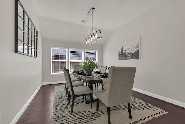 10718 Winding Green Dr, Humble, TX 77338 - dining area with lofted ceiling, baseboards, and dark wood-type flooring