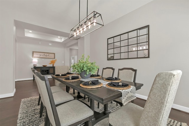 10718 Winding Green Dr, Humble, TX 77338 - dining area featuring baseboards, recessed lighting, wood finished floors, and a tray ceiling