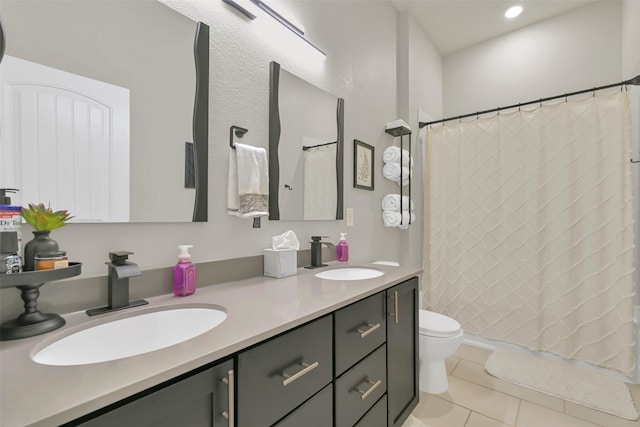 10718 Winding Green Dr, Humble, TX 77338 - bathroom featuring tile patterned floors, toilet, double vanity, curtained shower, and recessed lighting