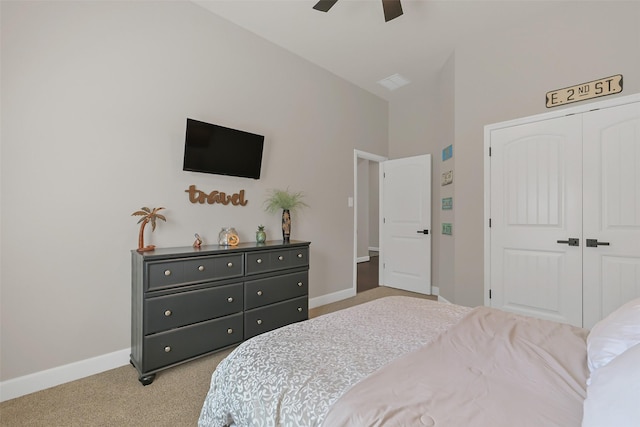 10718 Winding Green Dr, Humble, TX 77338 - bedroom with light carpet, baseboards, a closet, and ceiling fan