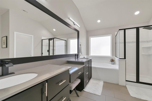 10718 Winding Green Dr, Humble, TX 77338 - bathroom with a stall shower, lofted ceiling, vanity, a bath, and tile patterned flooring