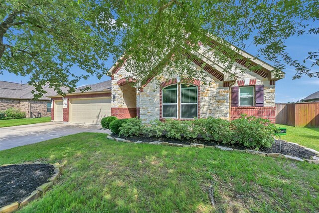 10718 Winding Green Dr, Humble, TX 77338 - view of front of property with stone siding, an attached garage, and concrete driveway