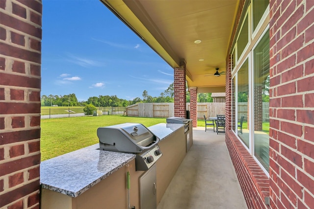 10718 Winding Green Dr, Humble, TX 77338 - view of patio with exterior kitchen, grilling area, and ceiling fan