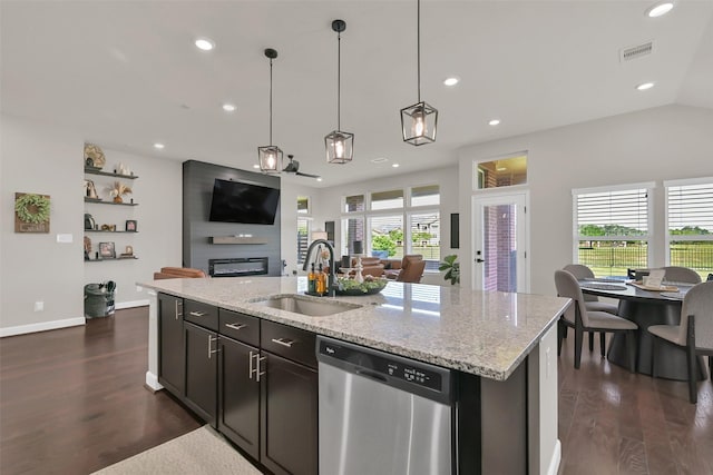 10718 Winding Green Dr, Humble, TX 77338 - kitchen featuring dishwasher, a sink, open floor plan, dark wood finished floors, and recessed lighting