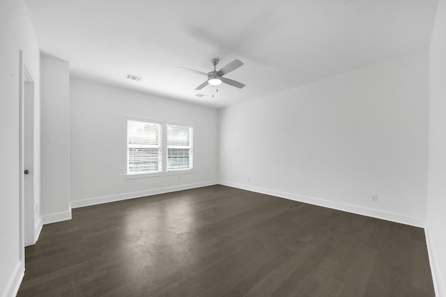 1515 Egypt St, Houston, TX 77009 - unfurnished room featuring ceiling fan, dark wood-type flooring, and baseboards