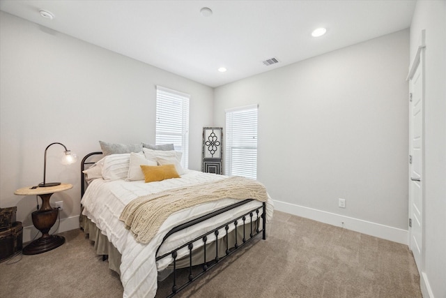 1226 W 17th St Unit E, Houston, TX 77008 - bedroom featuring baseboards, light colored carpet, and recessed lighting
