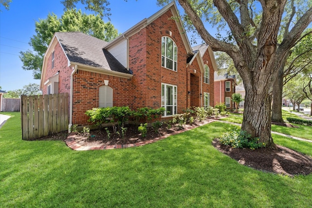 5418 Brook Bend Dr, Sugar Land, TX 77479 - view of side of home featuring brick siding and roof with shingles