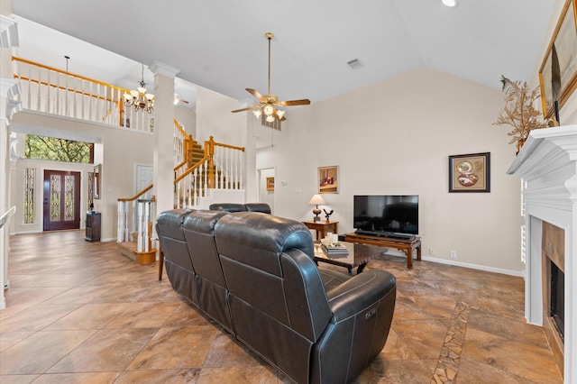 5418 Brook Bend Dr, Sugar Land, TX 77479 - living room featuring stairs, ceiling fan, a fireplace, high vaulted ceiling, and baseboards