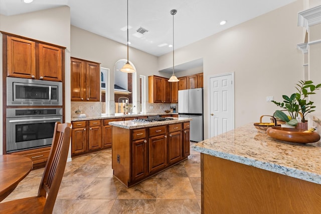 5418 Brook Bend Dr, Sugar Land, TX 77479 - kitchen with appliances with stainless steel finishes, backsplash, brown cabinetry, recessed lighting, and a high ceiling