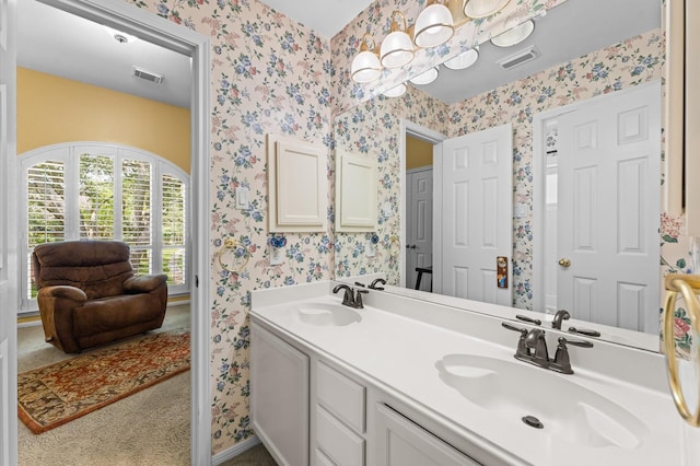 5418 Brook Bend Dr, Sugar Land, TX 77479 - full bathroom featuring wallpapered walls, double vanity, and baseboards
