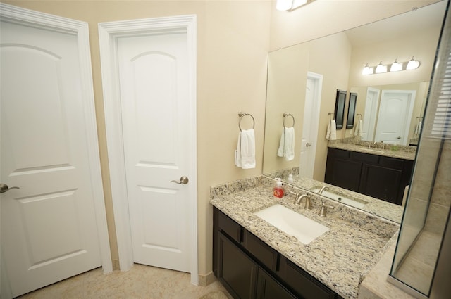 3411 Hawkins Glen Ln, Katy, TX 77449 - bathroom featuring two vanities and tile patterned flooring