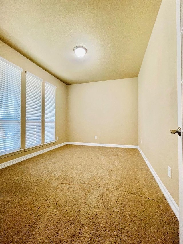3411 Hawkins Glen Ln, Katy, TX 77449 - unfurnished room featuring carpet floors, a textured ceiling, and baseboards