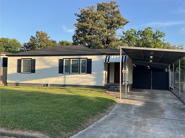 2105 12th St, Galena Park, TX 77547 - view of front of property with driveway, a front yard, and a carport