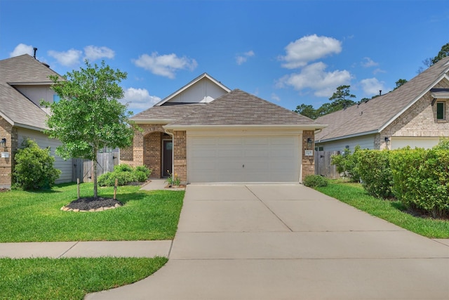 view of front of home featuring brick siding, a garage, concrete driveway, and roof with shingles