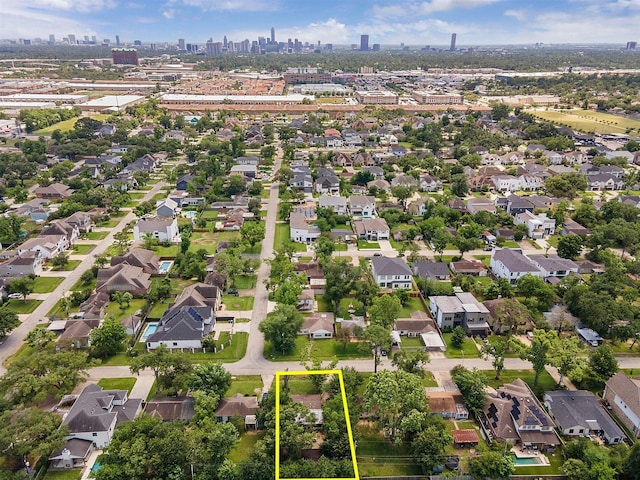 6502 Saxet St, Houston, TX 77055 - aerial perspective of suburban area with property boundaries highlighted and a view of skyline