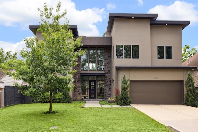 6502 Saxet St, Houston, TX 77055 - view of front facade with a garage, stucco siding, and driveway