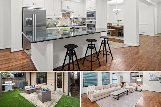 1117 Beall Landing Ct, Houston, TX 77008 - kitchen with appliances with stainless steel finishes, decorative backsplash, open floor plan, a kitchen breakfast bar, and white cabinets