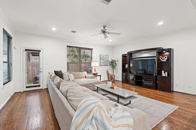 1117 Beall Landing Ct, Houston, TX 77008 - living room with ceiling fan, wood finished floors, recessed lighting, crown molding, and baseboards