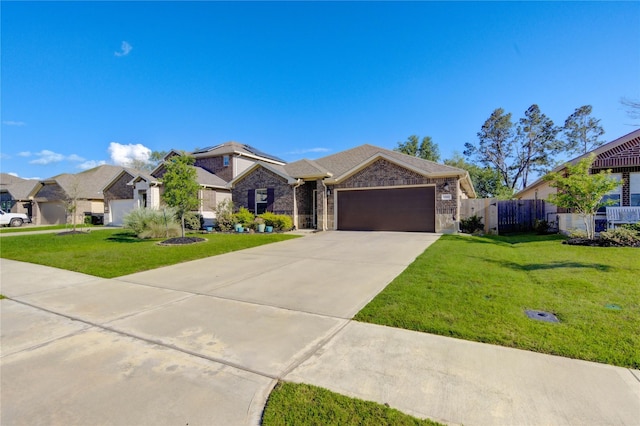 12917 S Winding Pines Dr, Tomball, TX 77375 - view of front of property featuring a garage, concrete driveway, a residential view, and brick siding