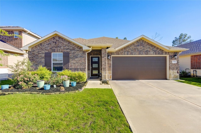 12917 S Winding Pines Dr, Tomball, TX 77375 - single story home featuring an attached garage, brick siding, a front lawn, concrete driveway, and a shingled roof