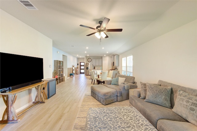 12917 S Winding Pines Dr, Tomball, TX 77375 - living area featuring a ceiling fan, light wood finished floors, and recessed lighting