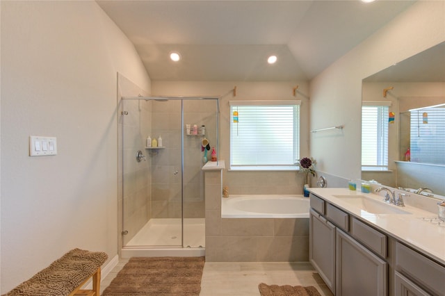 12917 S Winding Pines Dr, Tomball, TX 77375 - bathroom with a shower stall, a garden tub, recessed lighting, vanity, and lofted ceiling