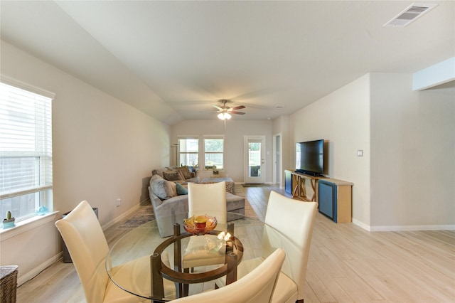 12917 S Winding Pines Dr, Tomball, TX 77375 - dining area featuring light wood-style floors, a ceiling fan, and baseboards