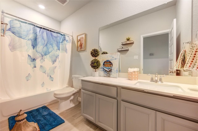 12917 S Winding Pines Dr, Tomball, TX 77375 - bathroom with vanity, toilet, wood finished floors, and shower / bath combo