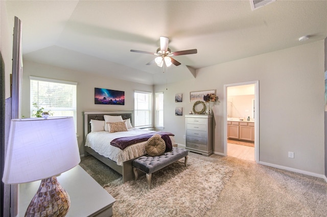 12917 S Winding Pines Dr, Tomball, TX 77375 - bedroom with light colored carpet, baseboards, ensuite bathroom, and a ceiling fan