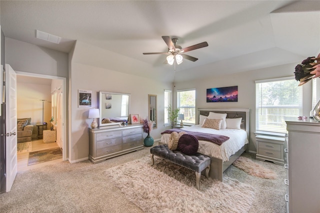 12917 S Winding Pines Dr, Tomball, TX 77375 - bedroom featuring light colored carpet, vaulted ceiling, baseboards, and a ceiling fan