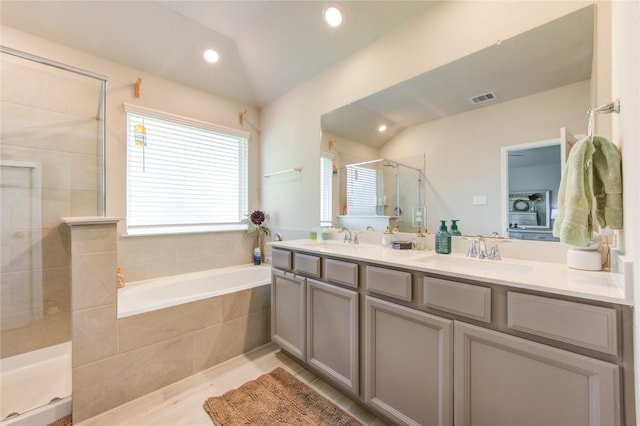 12917 S Winding Pines Dr, Tomball, TX 77375 - full bath featuring vaulted ceiling, a stall shower, double vanity, a bath, and recessed lighting