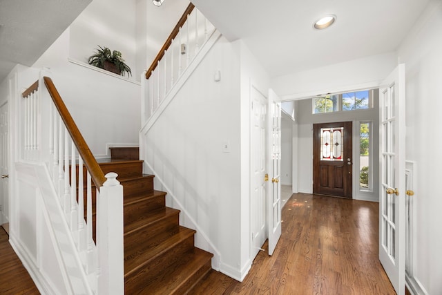 4402 Chipping Ct, Sugar Land, TX 77479 - foyer featuring stairs, wood finished floors, baseboards, and recessed lighting