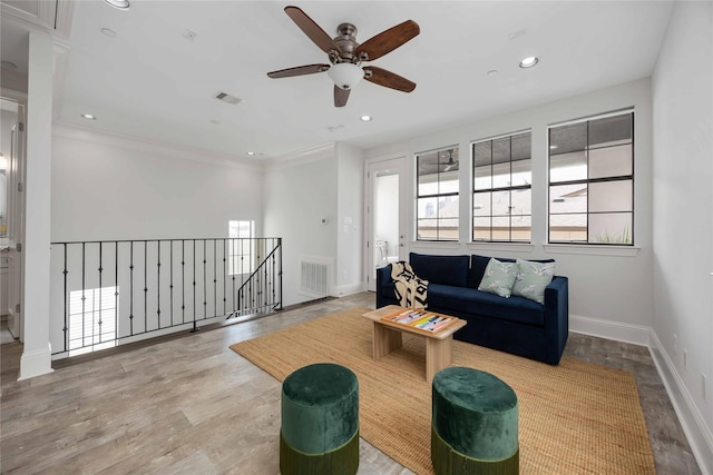 812 W Drew St, Houston, TX 77006 - living area with a ceiling fan, baseboards, recessed lighting, wood finished floors, and crown molding